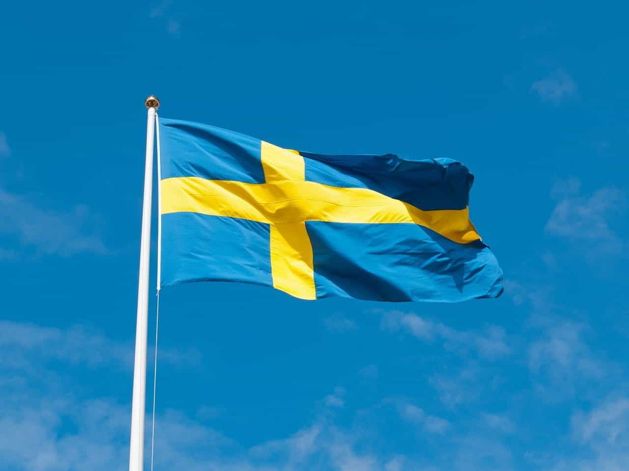 Swedish flag on a flagpole.