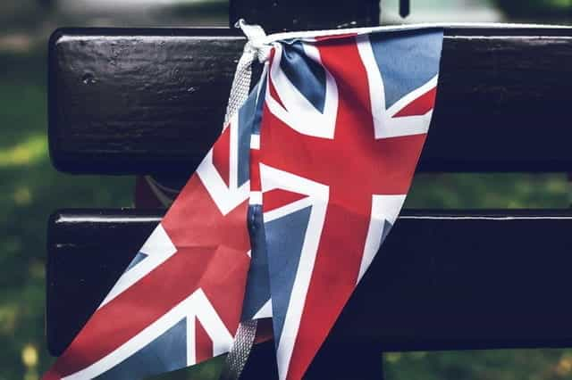 Union Jack flags on a bench.