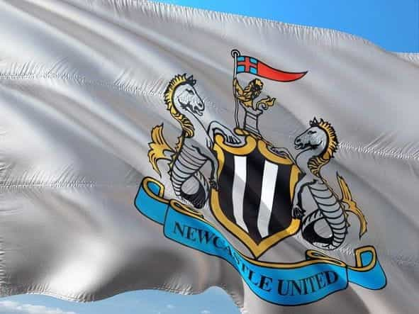 A white flag with the Newcastle United football club crest.