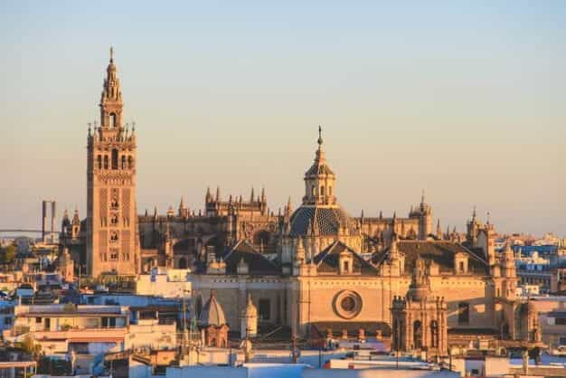 The Cathedral of Saint Mary of the See, Seville, Spain, at sunset.