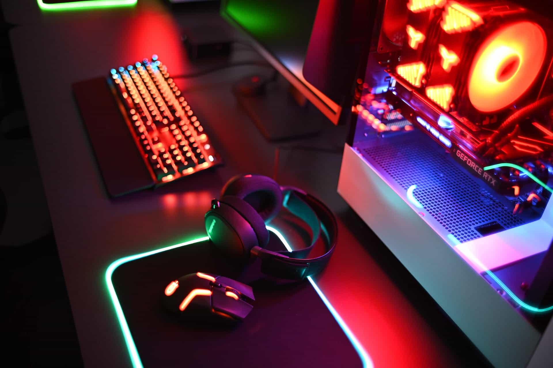 Gaming set with neon lights on a desk.