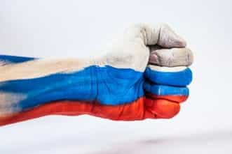 A fist painted in the colors of the Russian flag