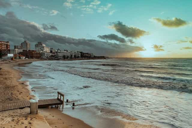 The beach with high rise buildings in the distance, in Punta del Este, Uruguay.