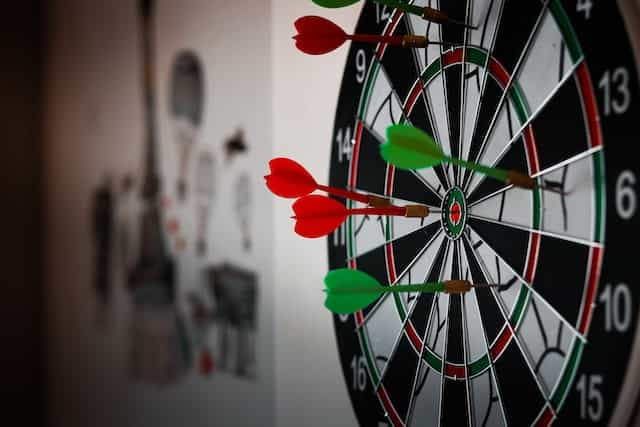 A dartboard with darts.