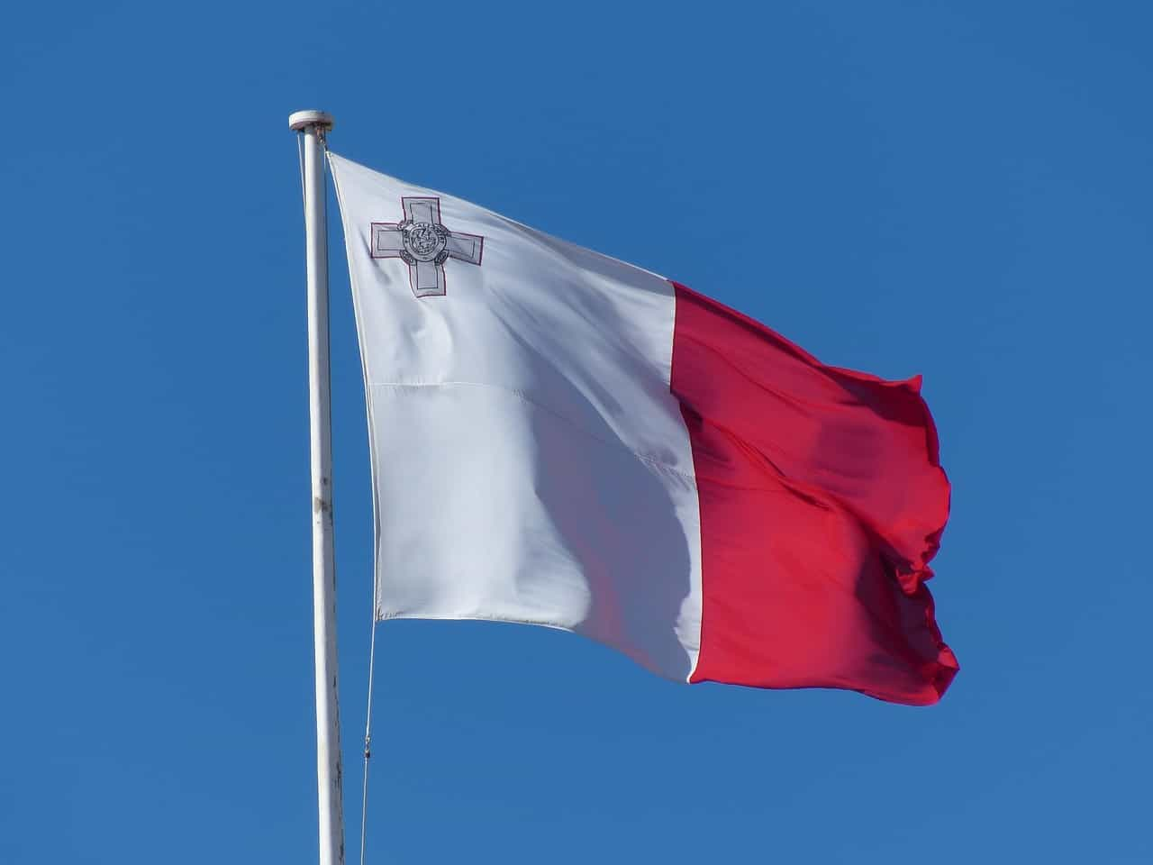 A flag against a blue sky.