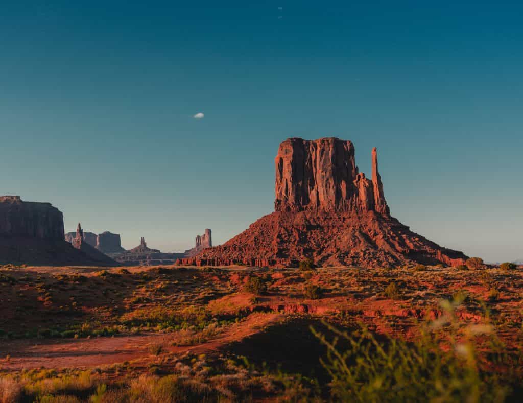 The Mars-like surface of the rural Arizona desert, featuring several oddly shaped mountains emerging out of the otherwise flat and arid landscape.