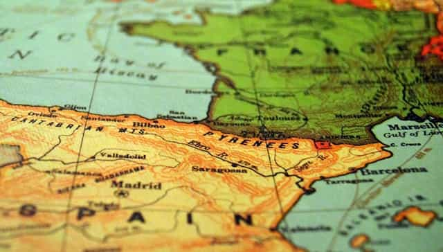 A shallow focus image of Spain on a world map.