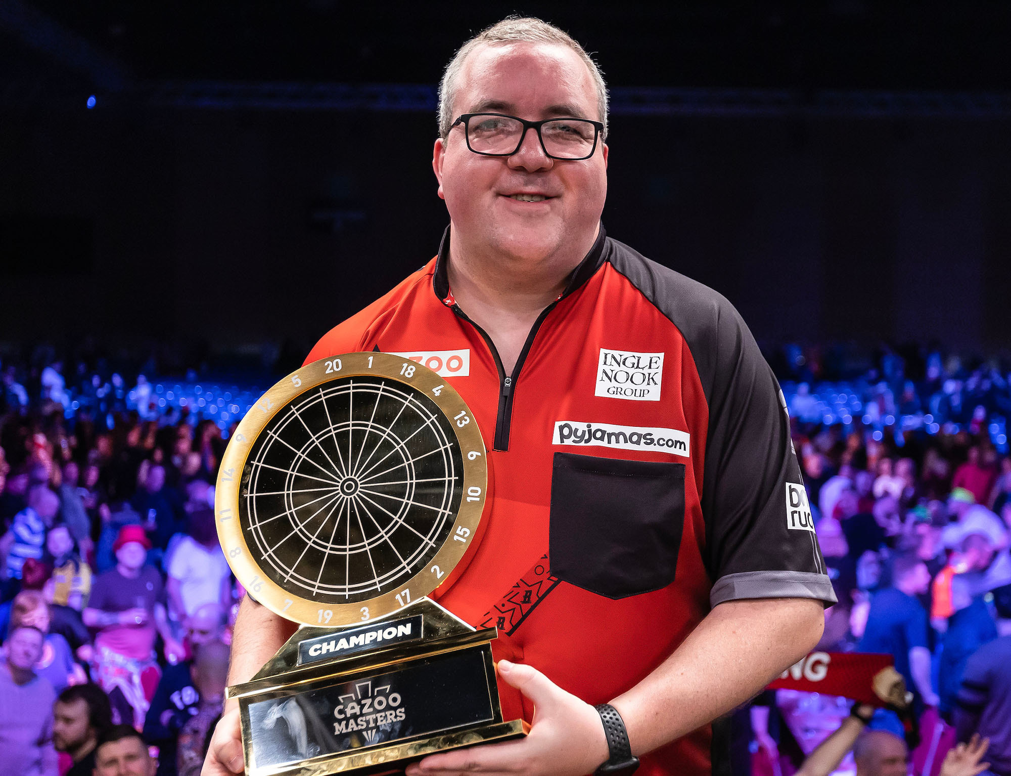 Darts player Stephen Bunting with his 2024 Masters trophy.